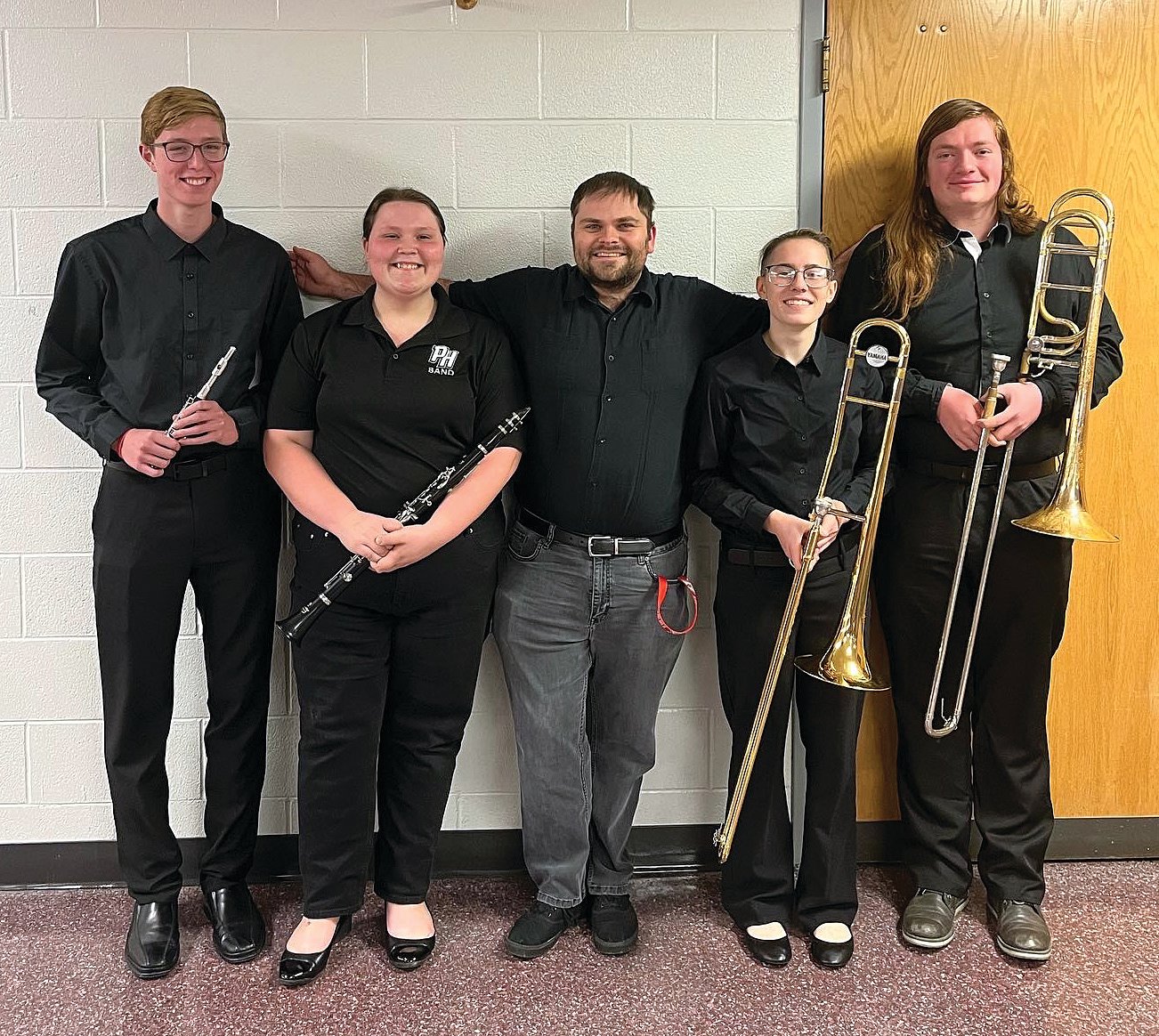 Four Parke Heritage High School musicians participated in the annual Indiana Bandmasters Association All-District Band hosted at Northview High School on Nov. 19-20. Performing were Treyton Burgess, piccolo; Ashlyn Hybarger, clarinet; and Alison Nicholas and Aidan Gillooly, trombones. They joined the 90 students from 15 area schools to perform a concert on Sunday afternoon. On Saturday, the group rehearsed for over six hours to prepare for the concert. Guest conductor for the event was Dr. Stephen L. Gage who is serving as the Interim Director of Bands in the Indiana State University School of Music. The All District Band provides an opportunity for high school musicians to perform with other young musicians and work with highly respected music educators and conductors. The PHHS band director is Alec Moeller. Pictured are Treyton Burgess, Ashlyn Hybarger, PHHS band director Alec Moeller, Alison Nicholas and Aidan Gillooly.